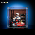 KGBOX standard acrylic display case with LEGO 21371 Wallace and Gromit motorbike, magnetic front door and UV-printed garage backdrop