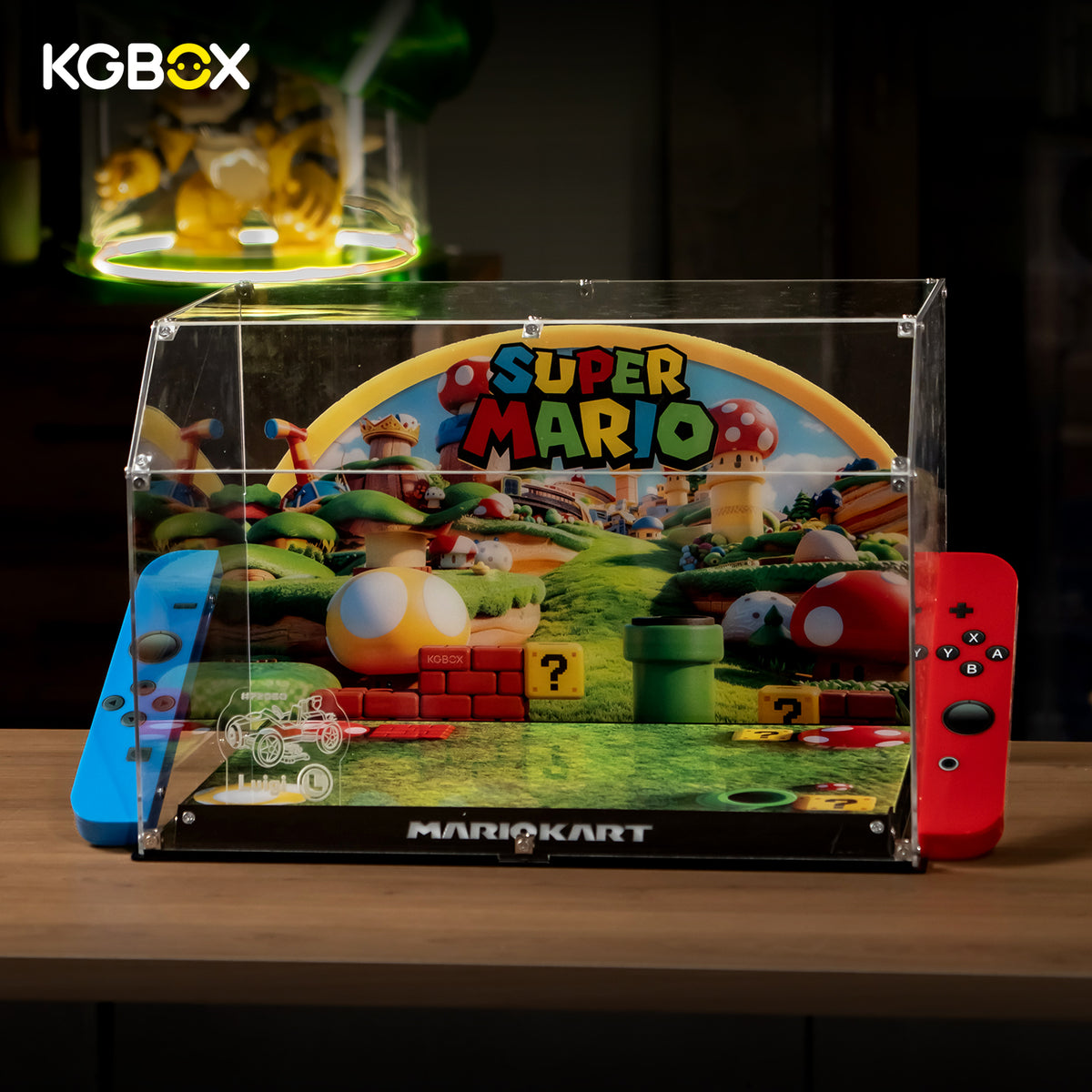 KGBOX clear acrylic display case for LEGO 72050 Mario Kart Luigi Mach 8 - front view of empty case with handheld-console design and red blue controller accents