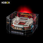 Tabletop placement showcase of lit KGBOX display case holding LEGO 10272 Old Trafford stadium