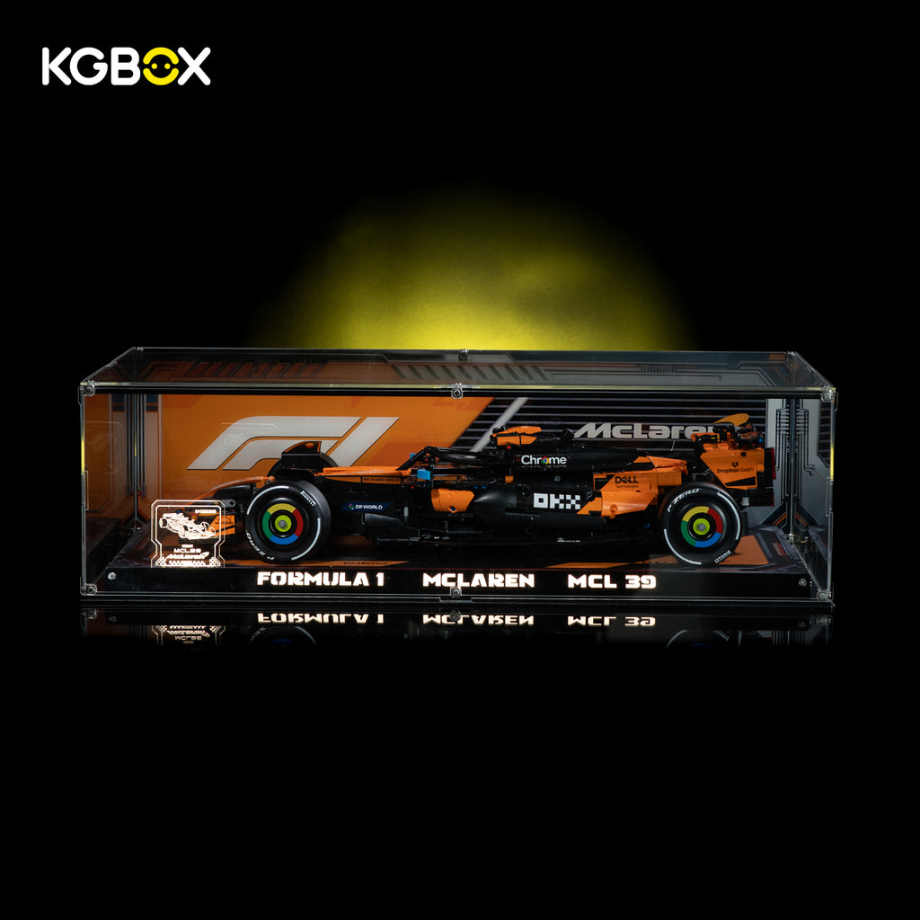 KGBOX premium LED UV tabletop display case for LEGO 42228 McLaren MCL39 F1 car, lit front view with complete Technic championship race car set