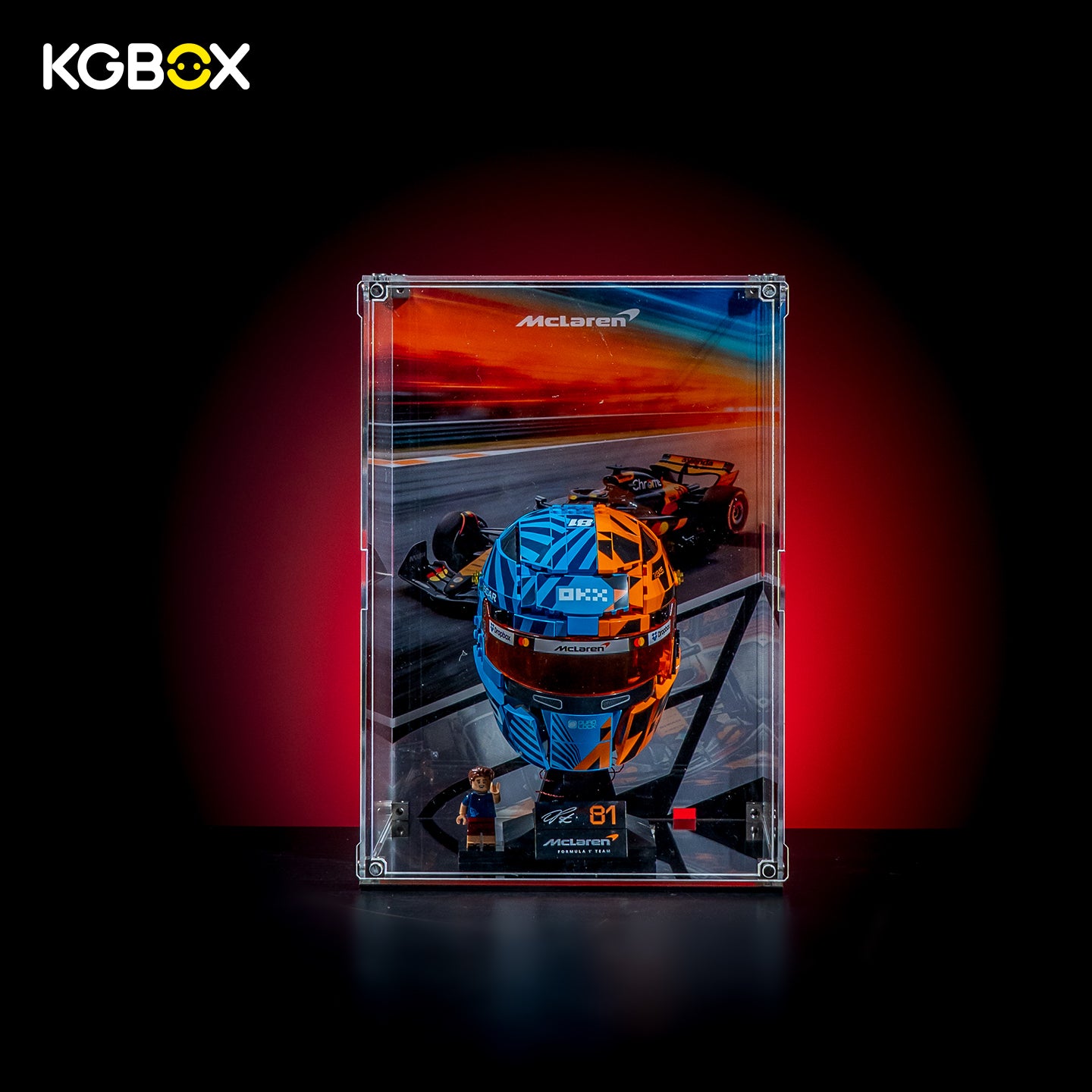 KGBOX Modular Assembly Edition acrylic display case loaded with LEGO 43017 Oscar Piastri McLaren Helmet, UV backplate, magnetic door and mirror base, front view