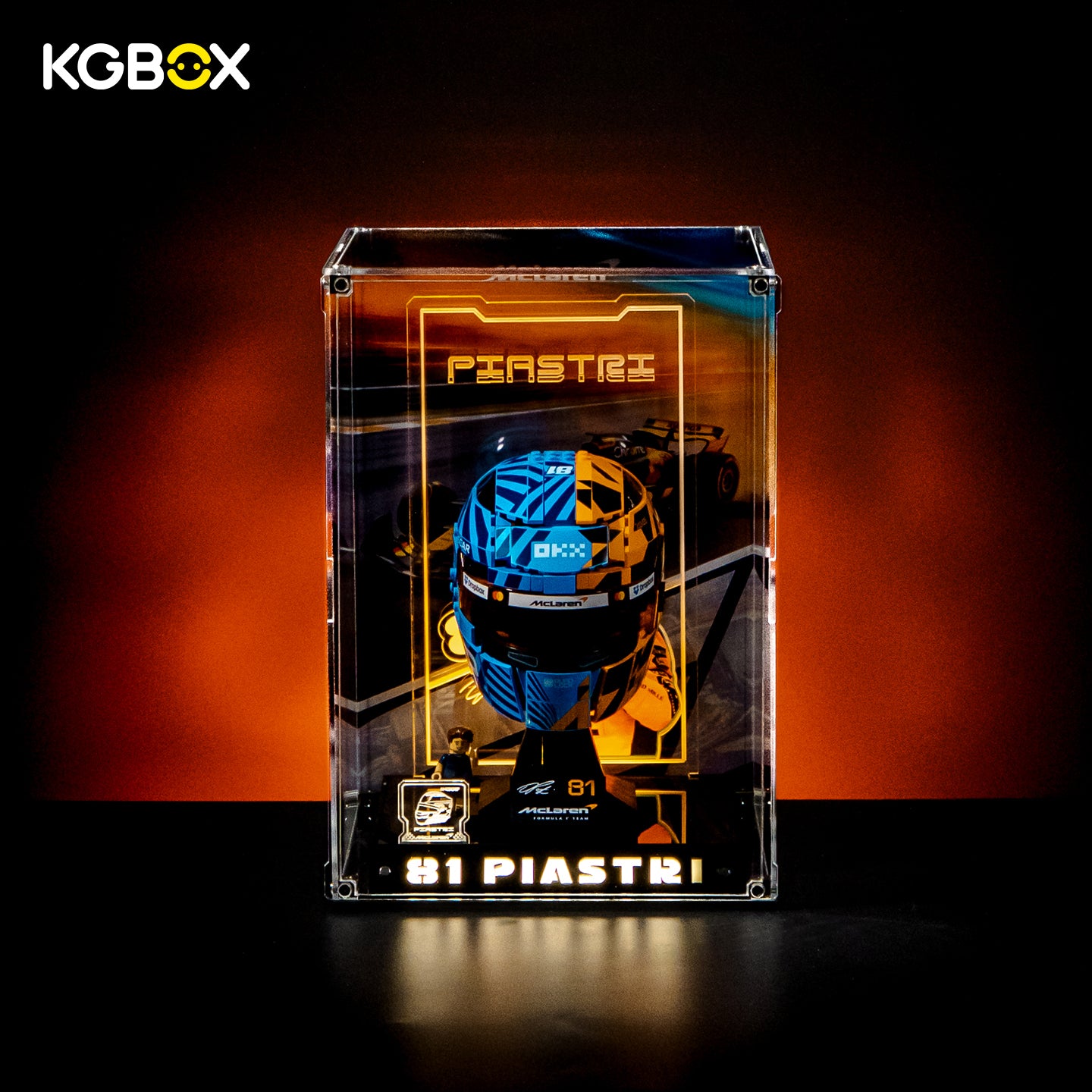 KGBOX Premium Collector Modular Edition display case with LED lights, engraved nameplate & laser‑etched insert, loaded with LEGO 43017 Oscar Piastri McLaren Helmet, front lit view